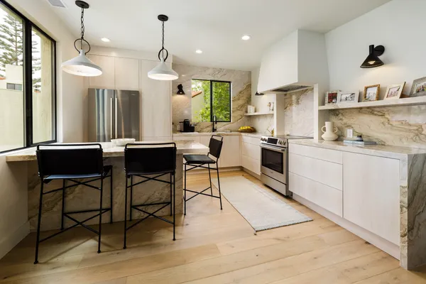 a view of an ocean with a mountain in the background