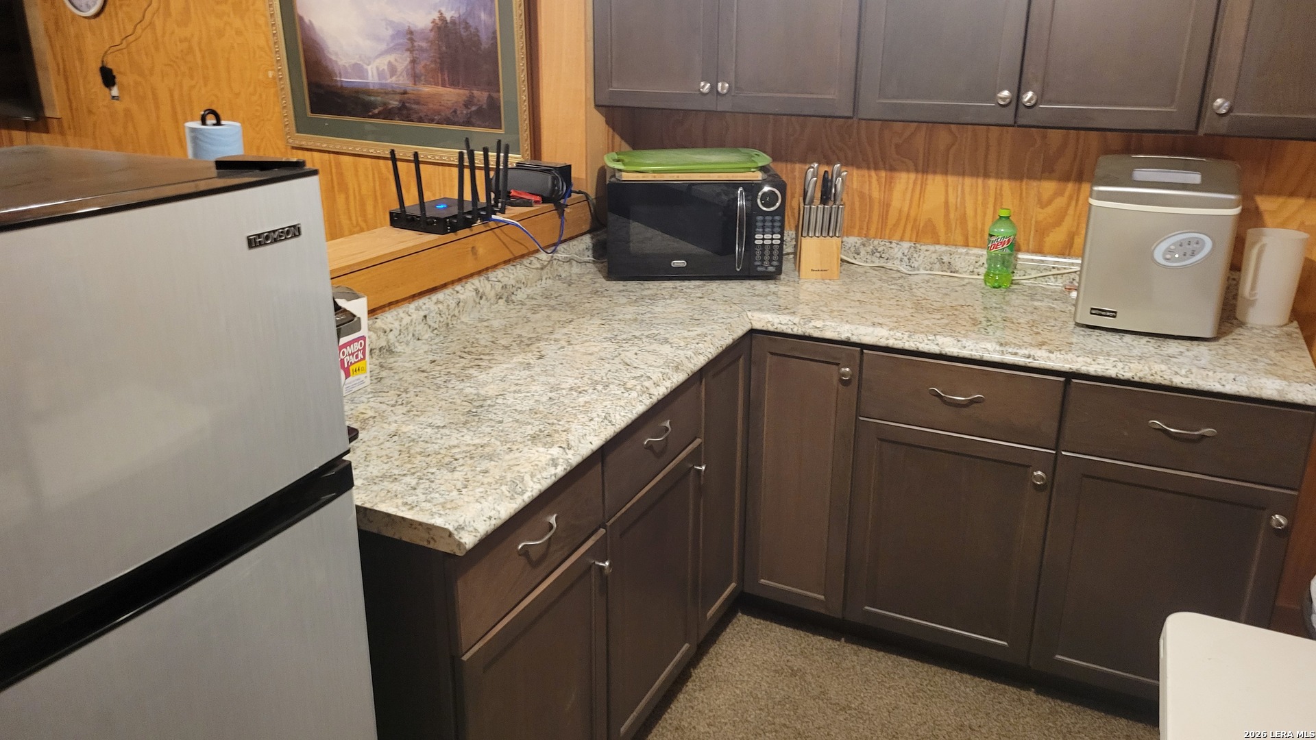 2190 Cr 650 Rocksprings Tx 78880 Del Rio, TX 78840 - Photo 27 of 62 a kitchen with granite countertop wood cabinets and white appliances