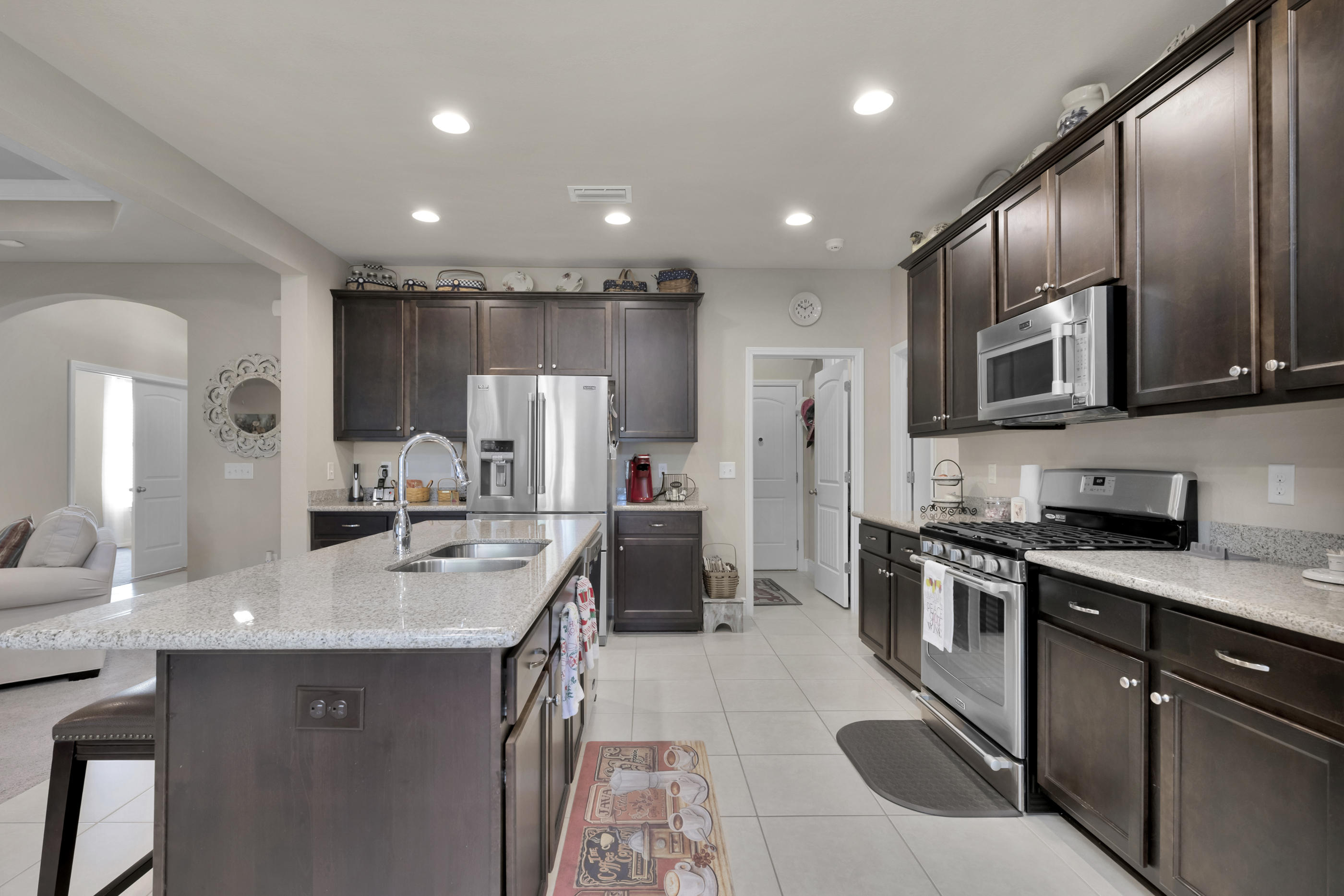 514 Brighton Cove Freeport, FL 32439 - Photo 11 of 32 a kitchen with stainless steel appliances granite countertop a sink stove and refrigerator
