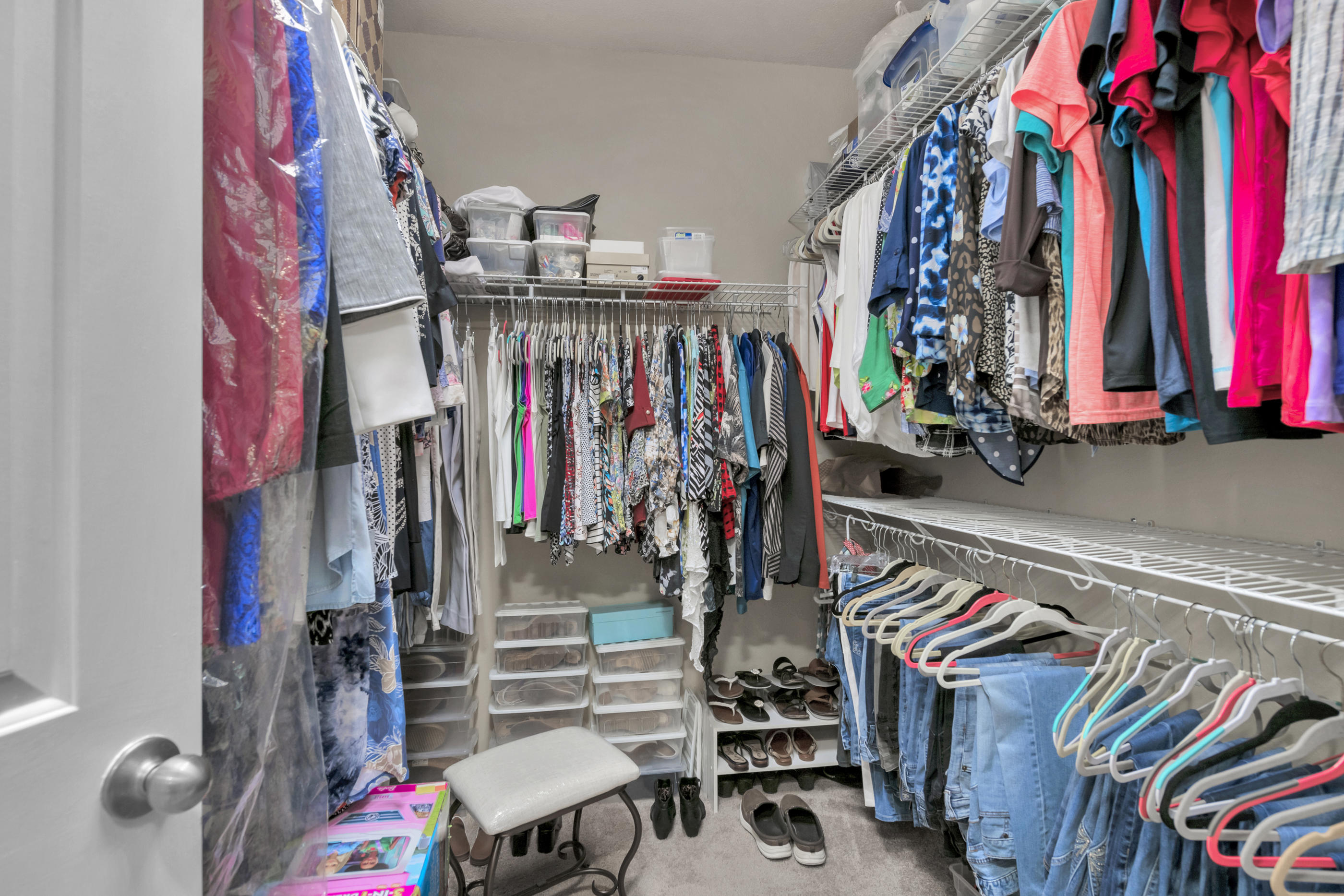 514 Brighton Cove Freeport, FL 32439 - Photo 21 of 32 a view of walk in closet with clothes