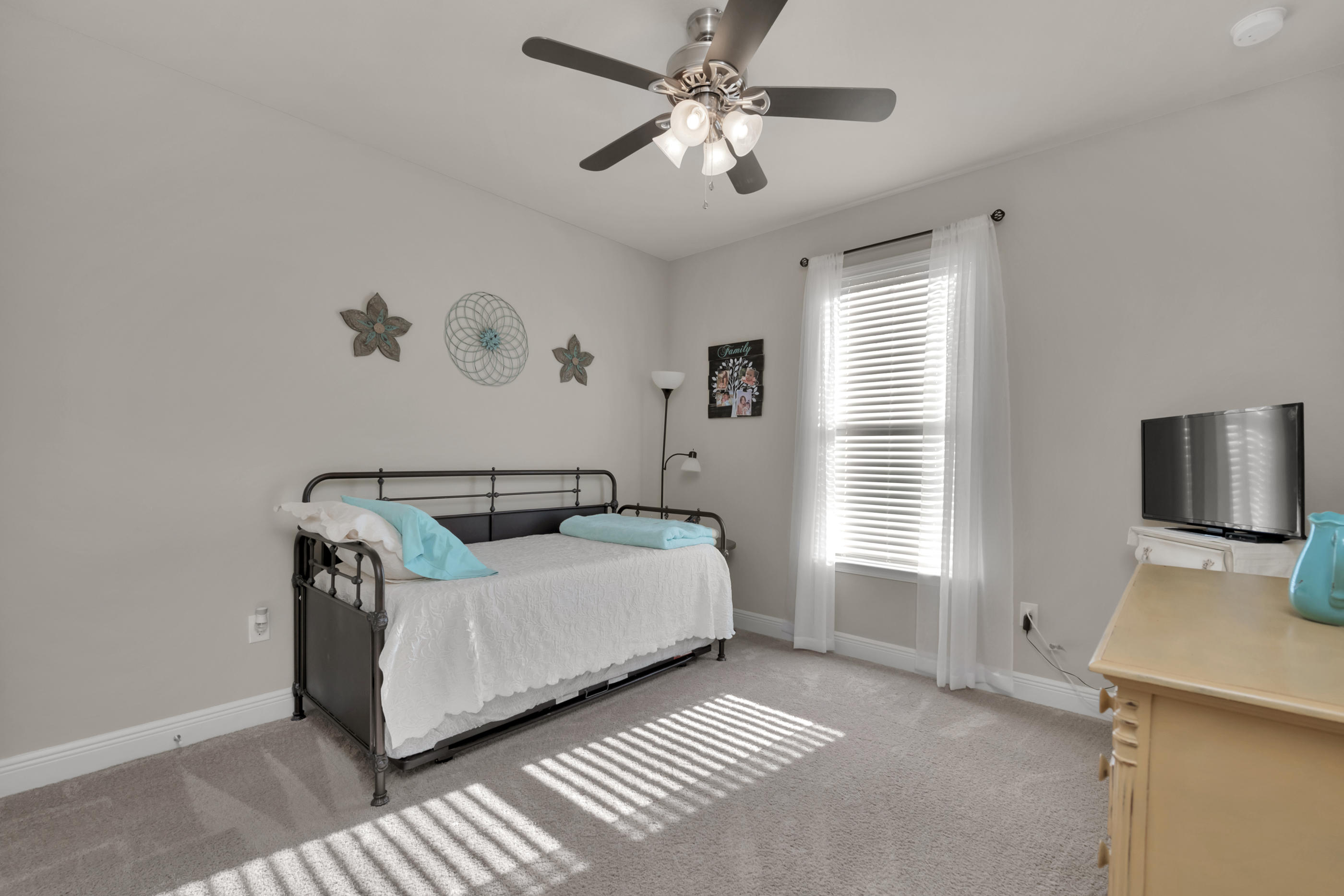 514 Brighton Cove Freeport, FL 32439 - Photo 24 of 32 a bedroom with a bed and a window