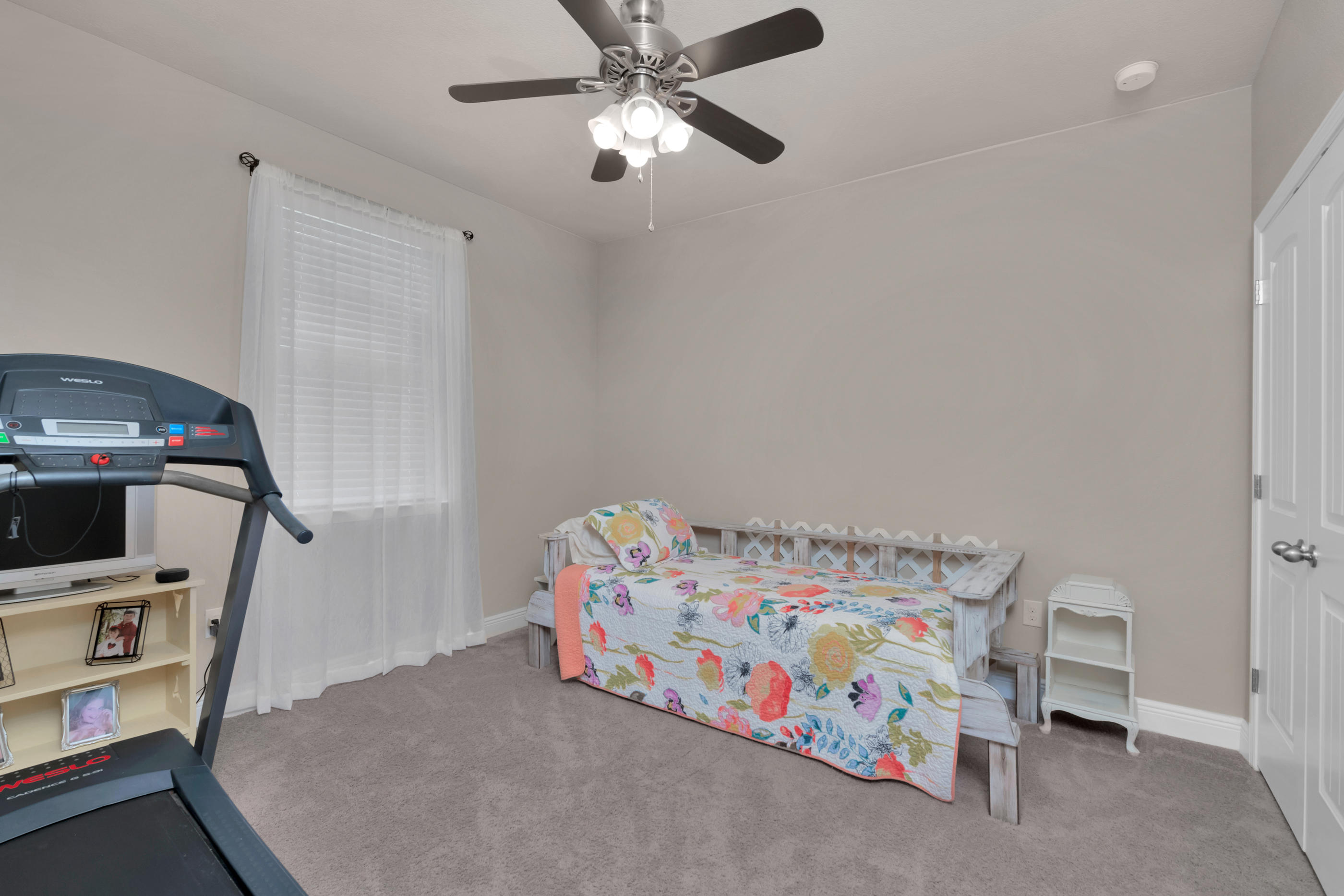 514 Brighton Cove Freeport, FL 32439 - Photo 26 of 32 a bedroom with a bed and a tv