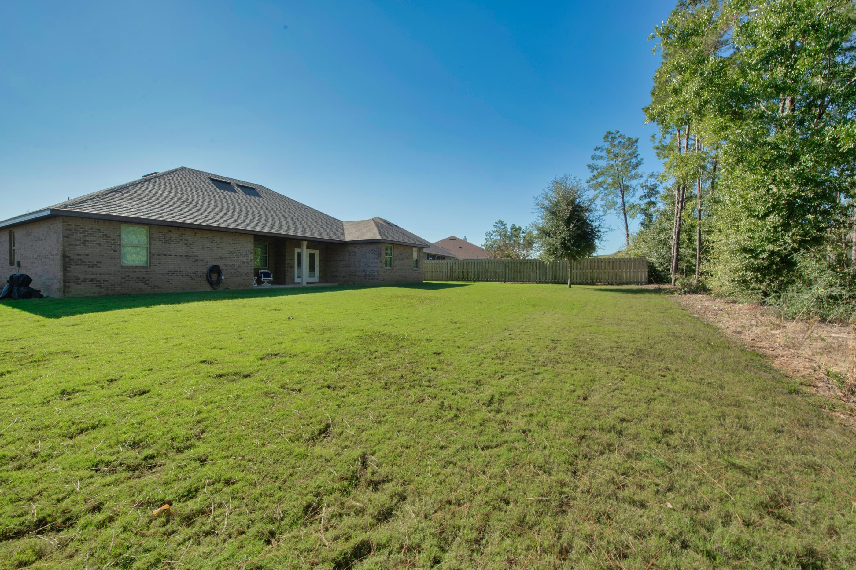 514 Brighton Cove Freeport, FL 32439 - Photo 31 of 32 a big house with a big yard
