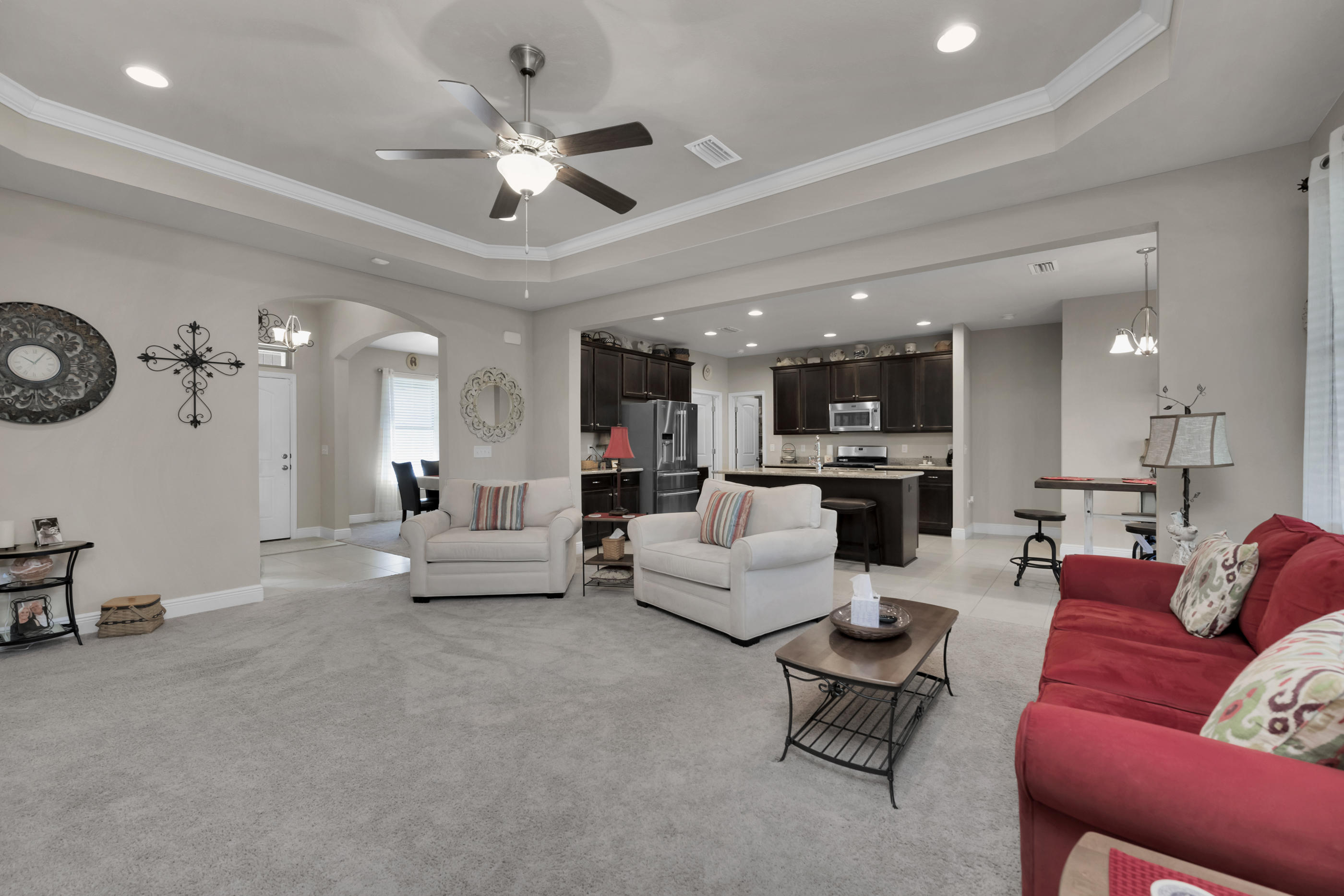514 Brighton Cove Freeport, FL 32439 - Photo 5 of 32 a living room with furniture kitchen view and a chandelier