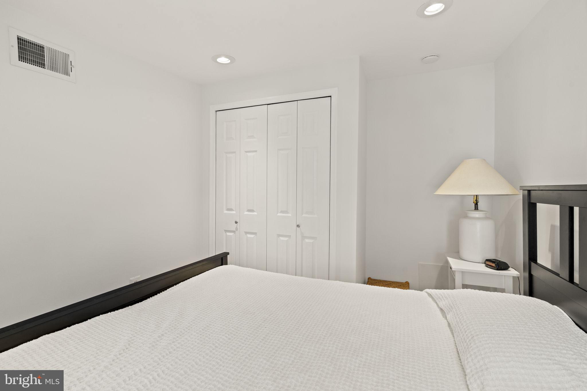 1913 Carpenter Street Philadelphia, PA 19146 - Photo 25 of 39 a bedroom with a bed and a lamp