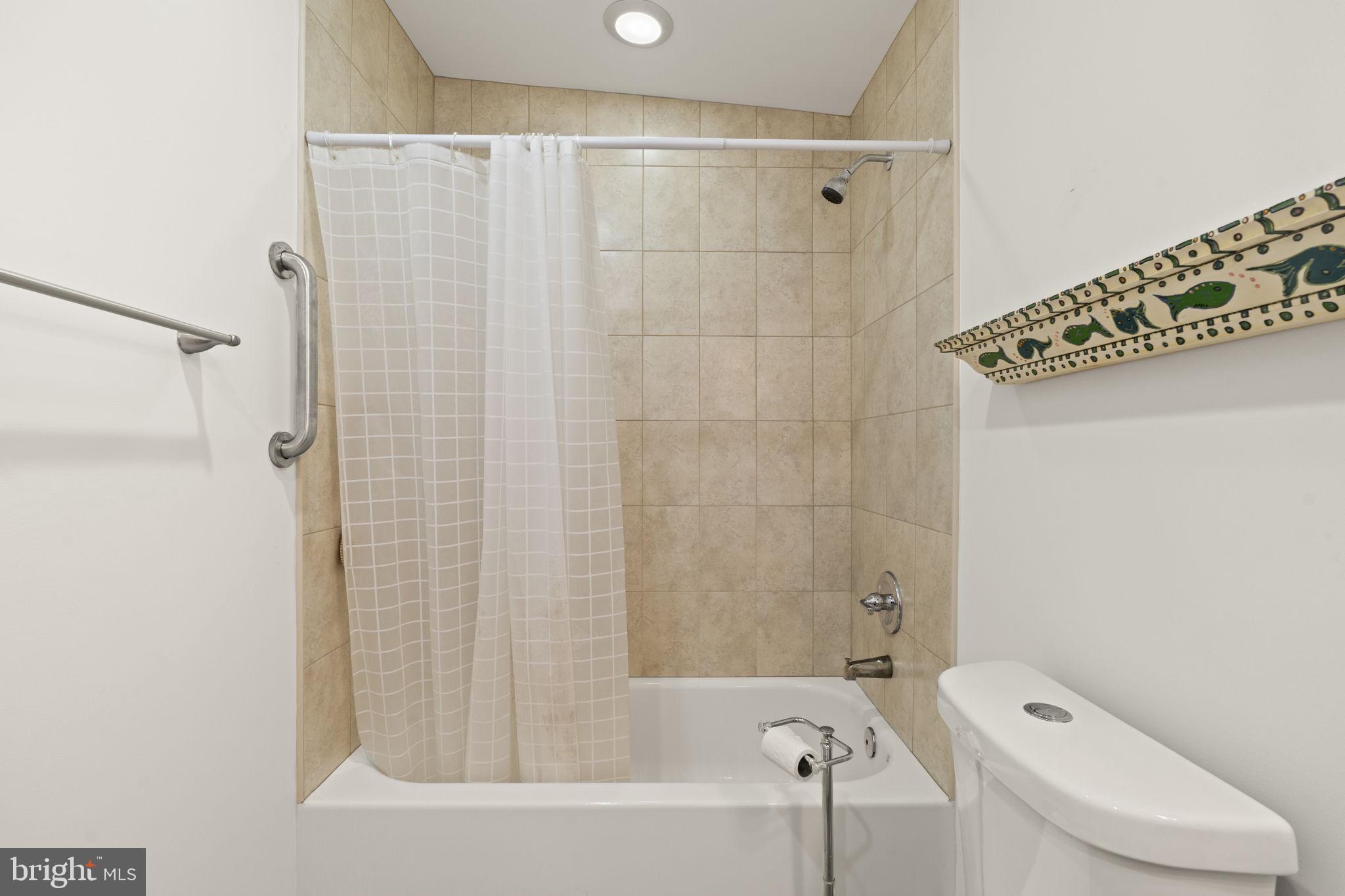 1913 Carpenter Street Philadelphia, PA 19146 - Photo 27 of 39 a bathroom with a bathtub and shower