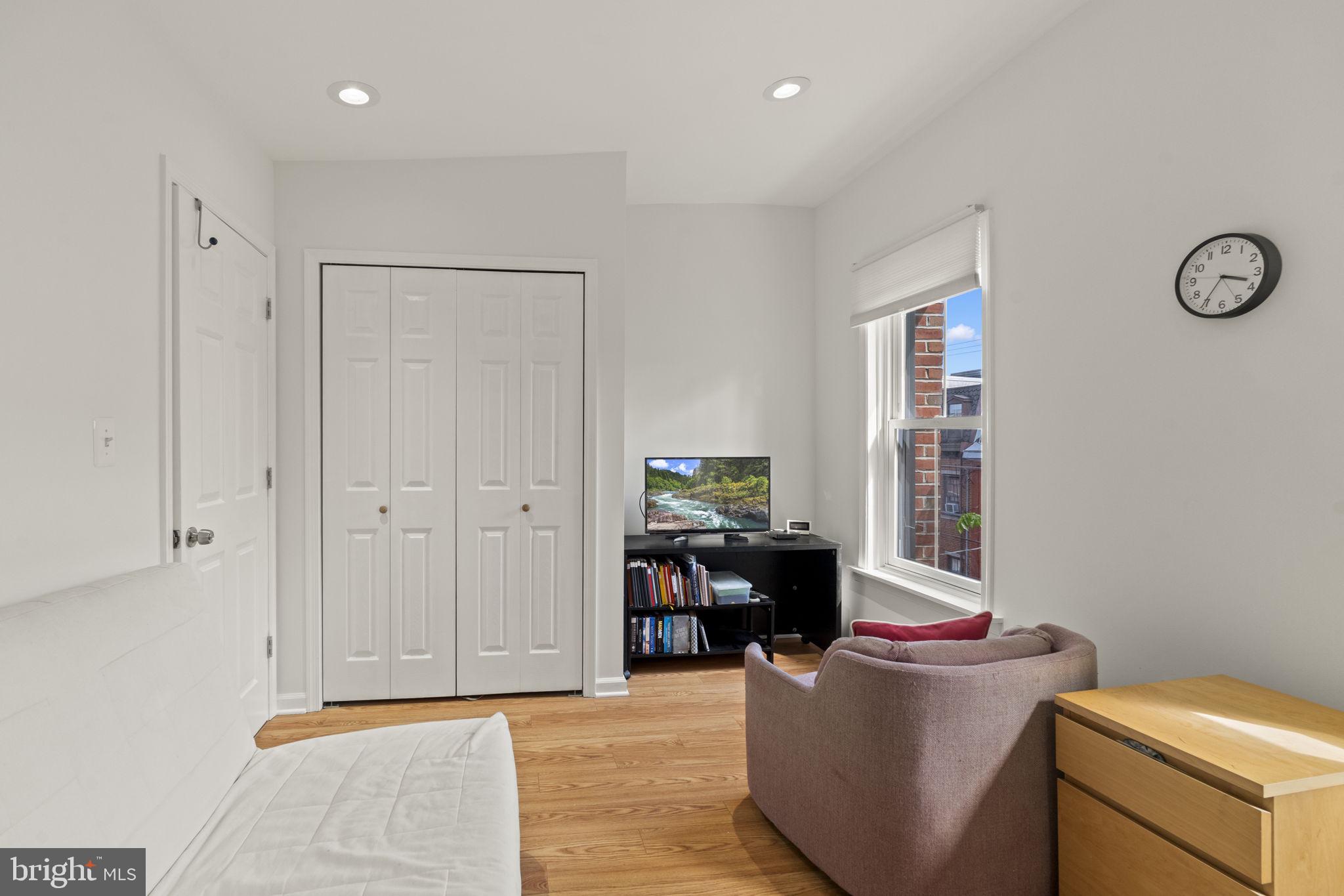 1913 Carpenter Street Philadelphia, PA 19146 - Photo 29 of 39 a living room with furniture a window and a lamp