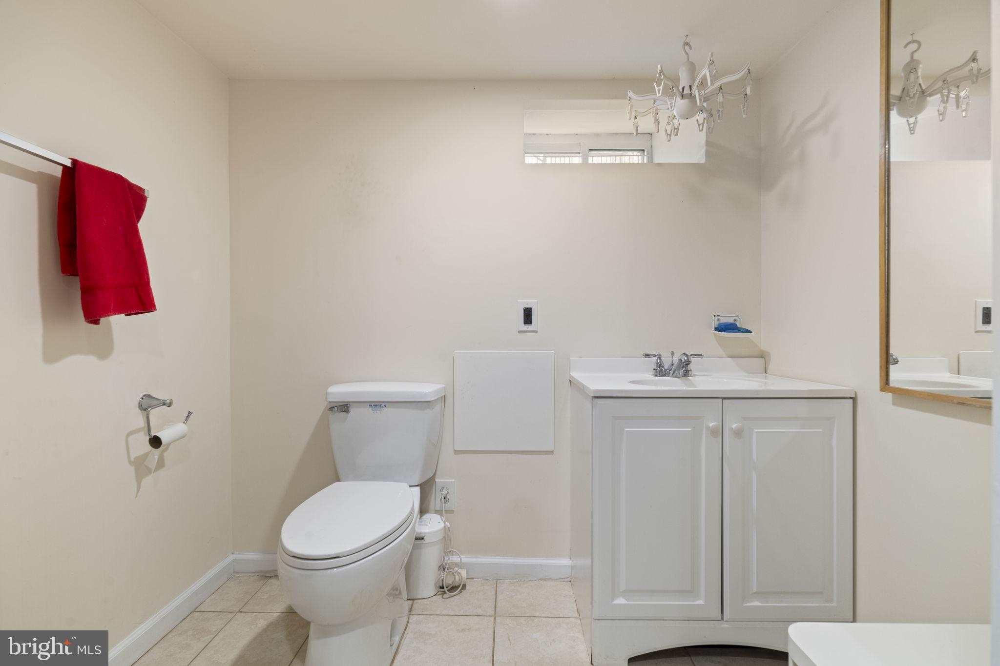 1913 Carpenter Street Philadelphia, PA 19146 - Photo 30 of 39 a bathroom with a sink a toilet and vanity