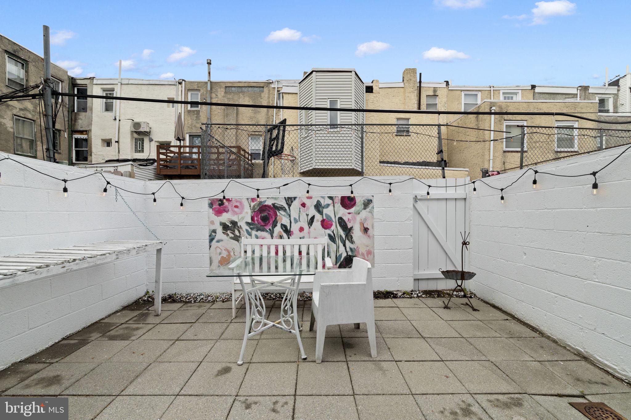 1913 Carpenter Street Philadelphia, PA 19146 - Photo 32 of 39 a view of a chairs and table in the terrace