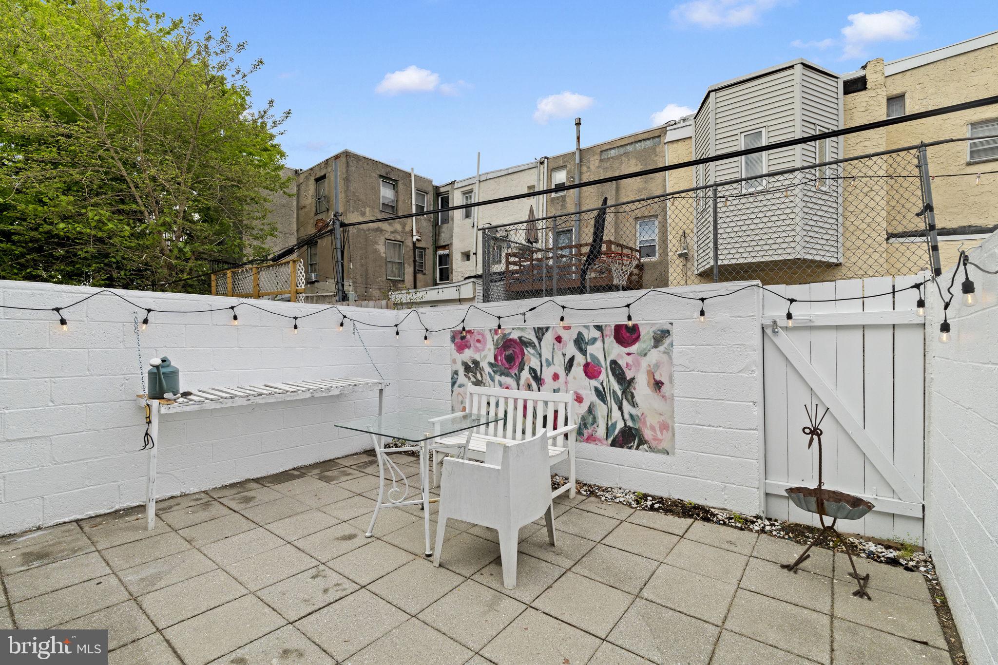 1913 Carpenter Street Philadelphia, PA 19146 - Photo 33 of 39 a view of a patio with table and chairs