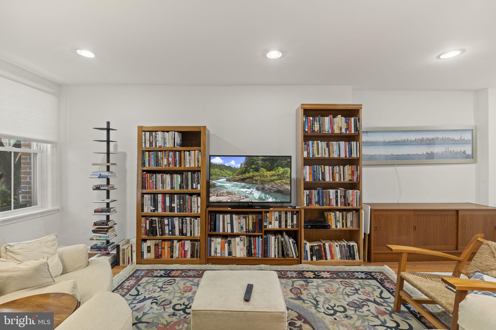 1913 Carpenter Street Philadelphia, PA 19146 - Photo 4 of 39 a living room with furniture and a book shelf