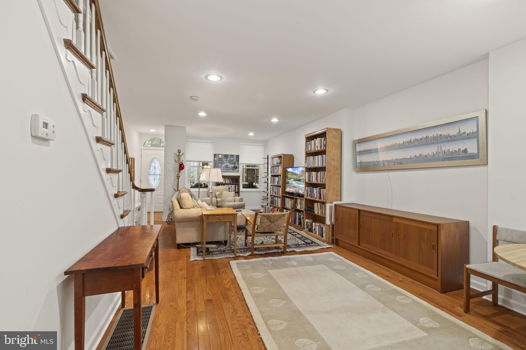 1913 Carpenter Street Philadelphia, PA 19146 - Photo 8 of 39 a living room with lots of furniture and a wooden floor