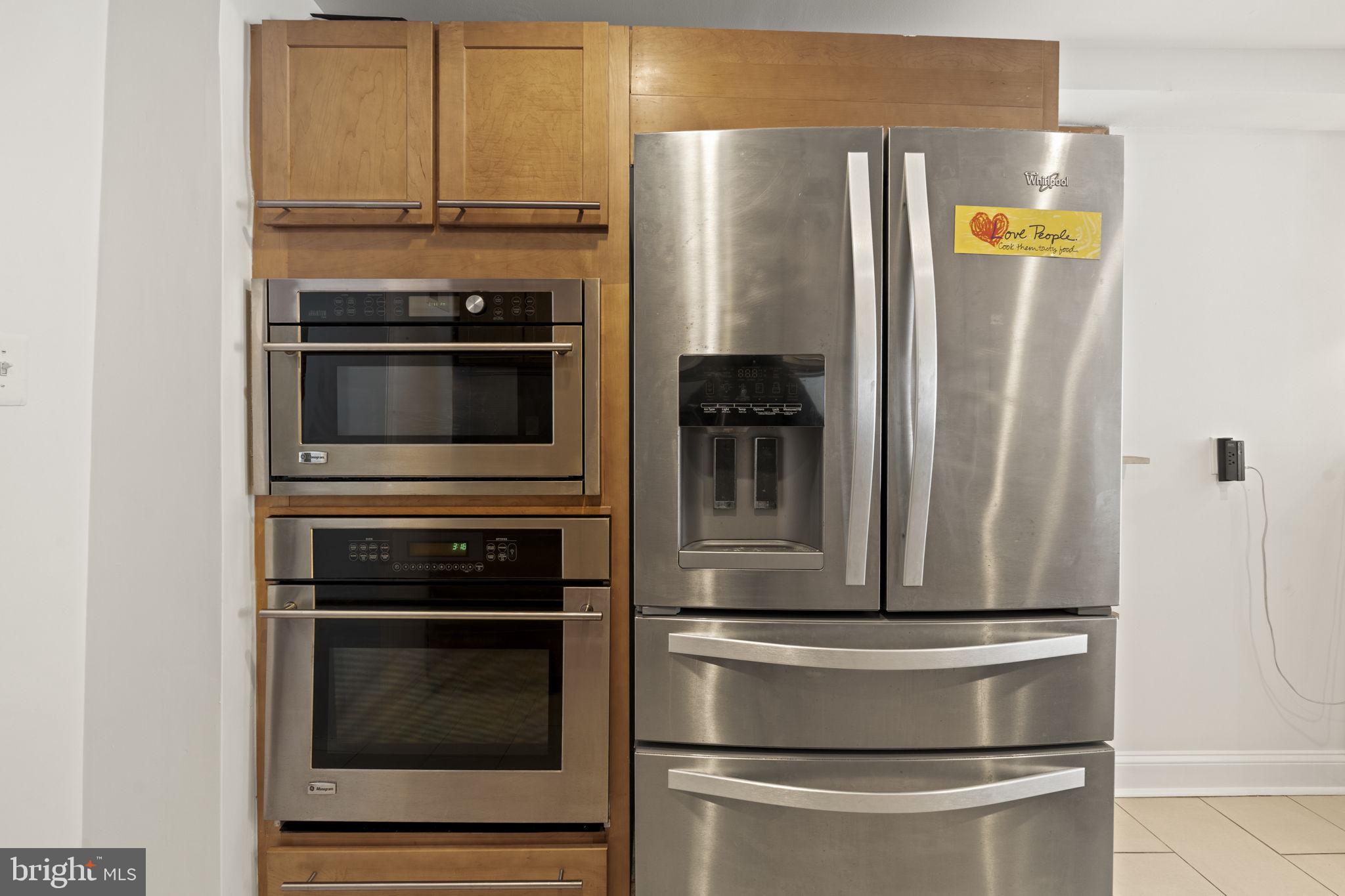 1913 Carpenter Street Philadelphia, PA 19146 - Photo 10 of 39 a metallic refrigerator freezer sitting in a kitchen