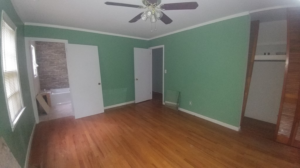 1348 Main Street Perry, GA 31069 - Photo 12 of 20 a view of empty room with wooden floor