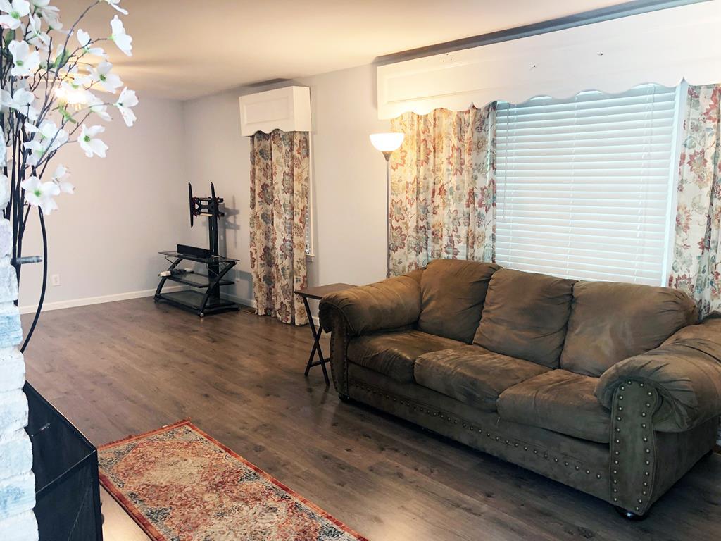 1348 Main Street Perry, GA 31069 - Photo 6 of 20 a living room with furniture and a window
