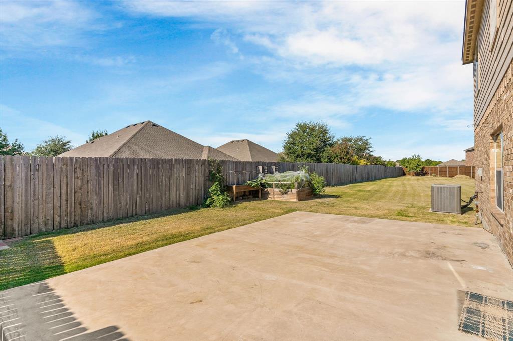 144 Perkins Street Anna, TX 75409 - Photo 24 of 31 a view of swimming pool with big yard and wooden fence
