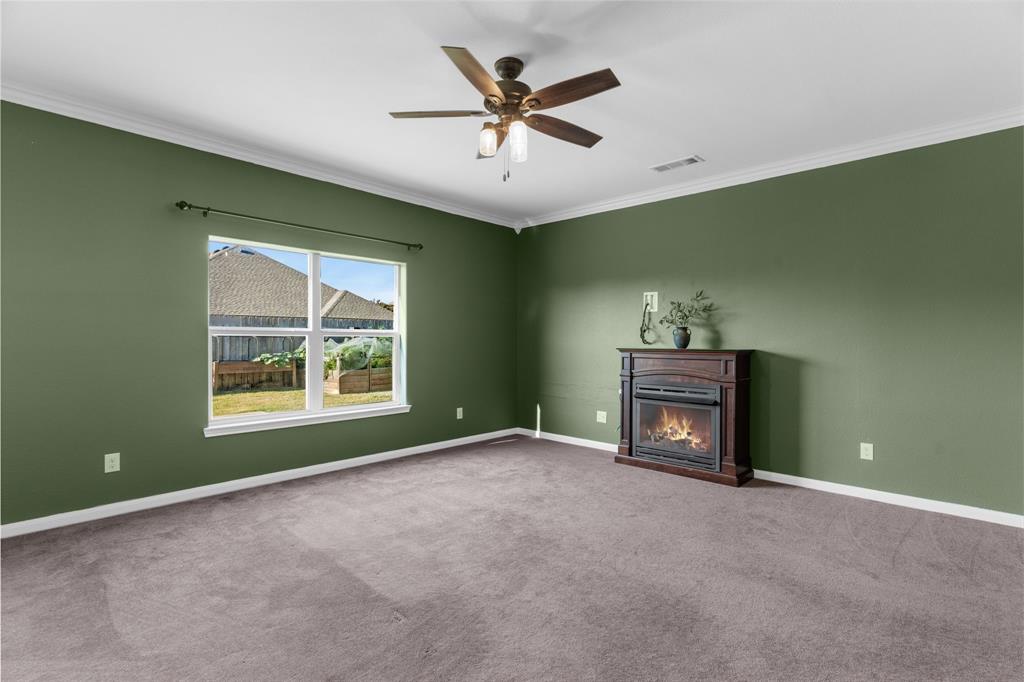 144 Perkins Street Anna, TX 75409 - Photo 3 of 31 a view of room with window and ceiling fan