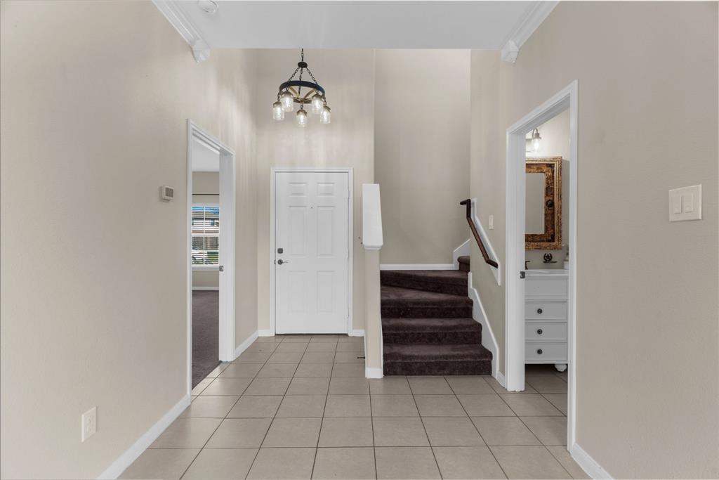 144 Perkins Street Anna, TX 75409 - Photo 9 of 31 a view of a hallway view with staircase
