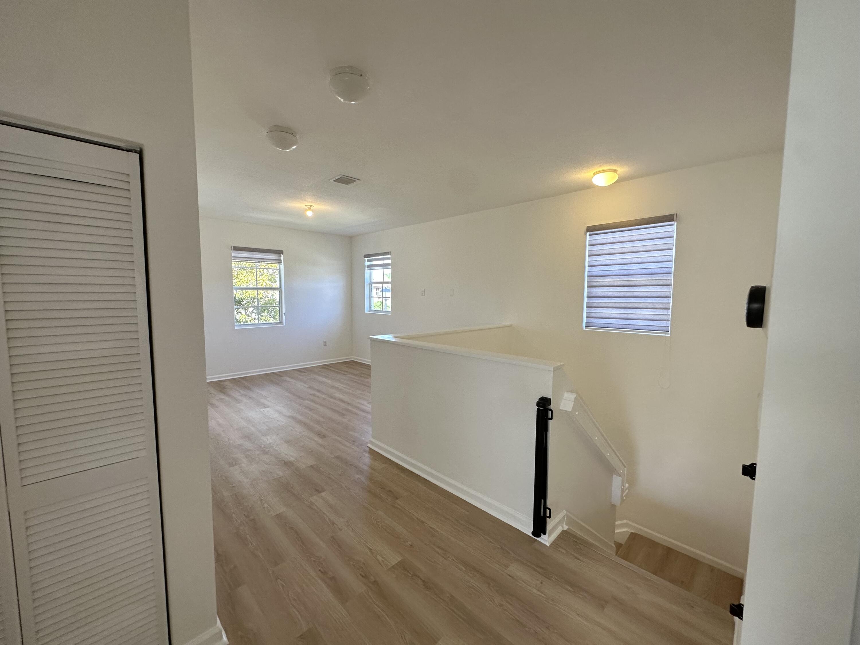 11608 Southwest 246 Terrace Homestead, FL 33032 - Photo 24 of 51 a view of empty room with wooden floor and fan
