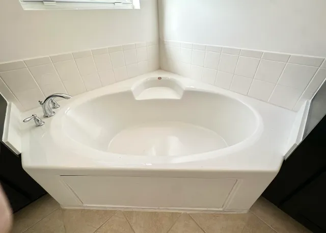 a bathroom with a white bath tub