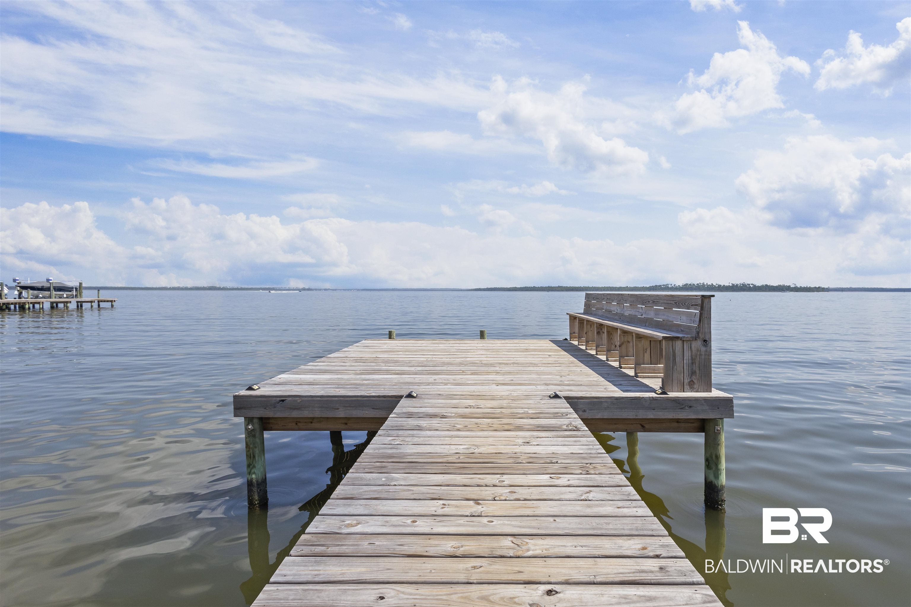 25925 Canal Road, Unit 207 Orange Beach, AL 36561 - Photo 35 of 42 View of dock with a water view