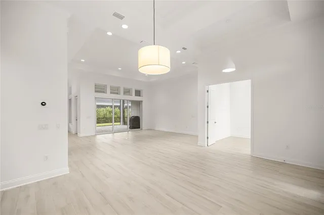 an aerial view of a house with garden space and street view