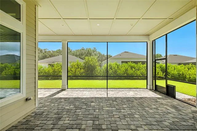 an aerial view of multiple houses with yard