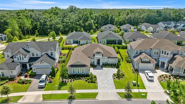a large kitchen with a large window and stainless steel appliances