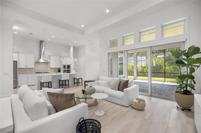 a view of a room with wooden floor and window