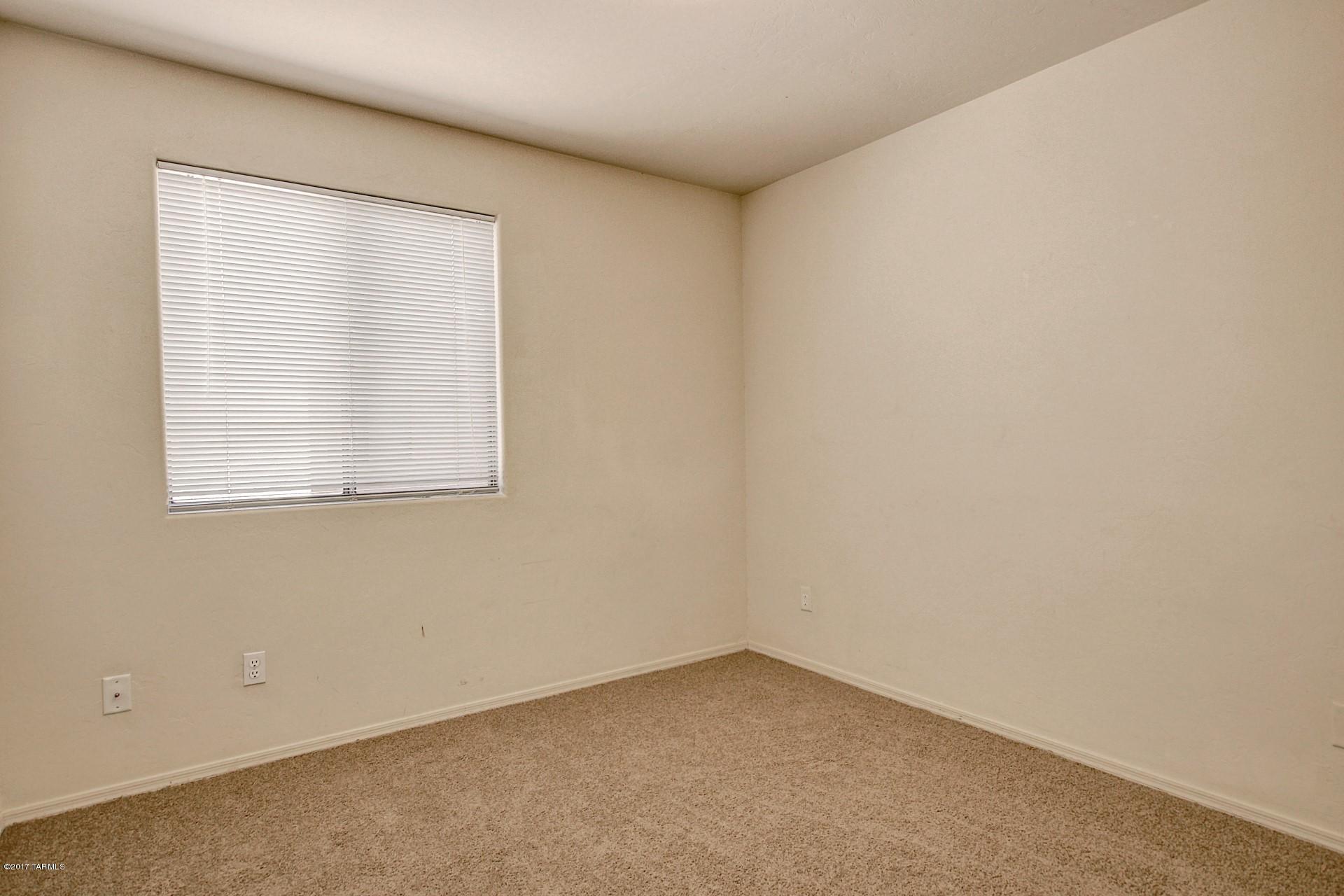8350 East Bowline Road Tucson, AZ 85710 - Photo 19 of 26 an empty room with a window