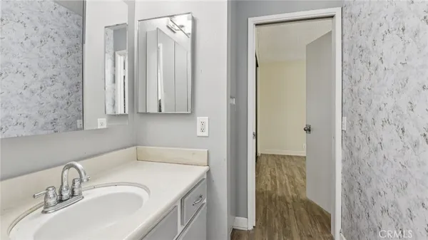 a bathroom with a sink and a mirror