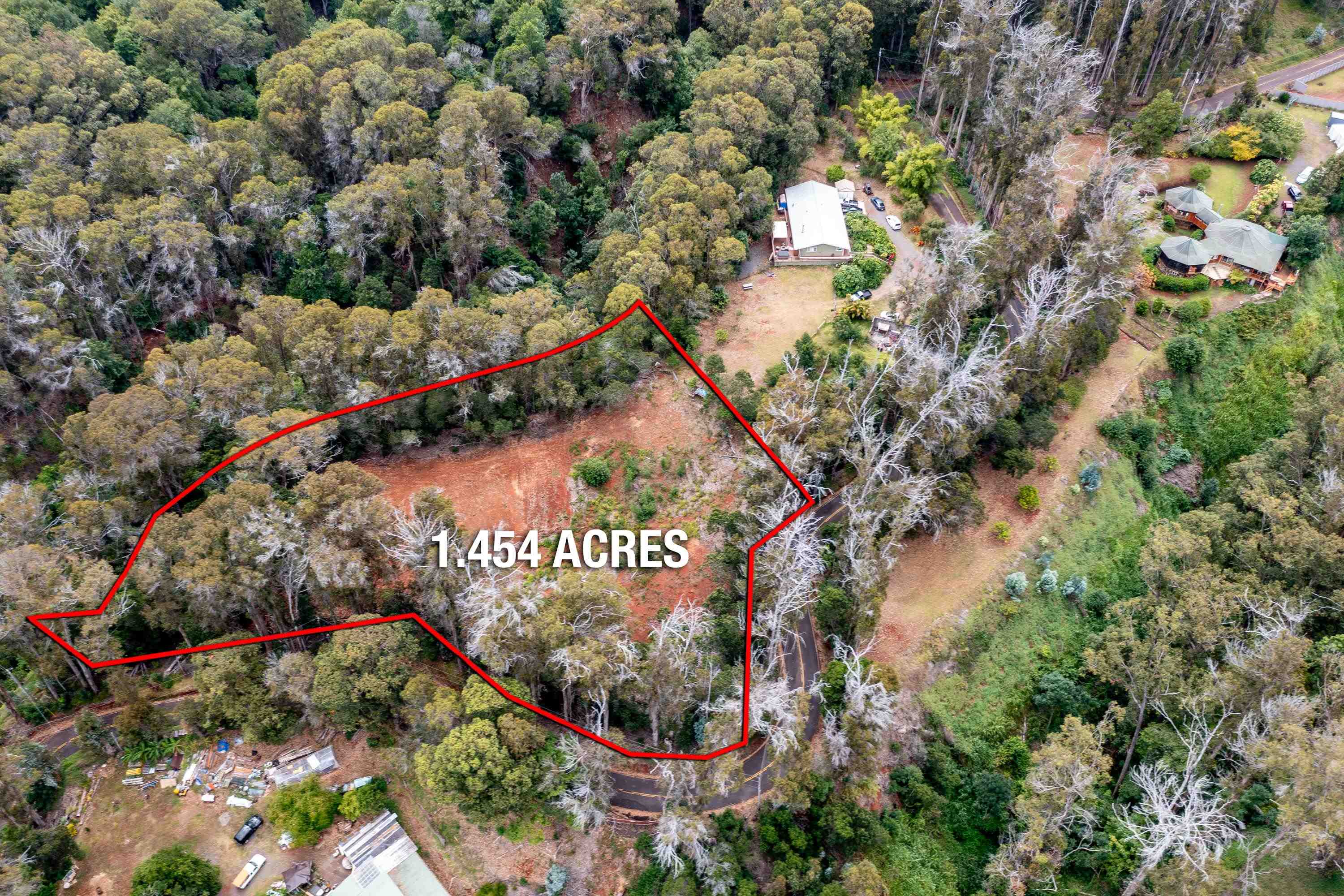 1939 B Piiholo Road, Unit B Makawao, HI 96768 - Photo 24 of 37 a sign that is sitting in a forest