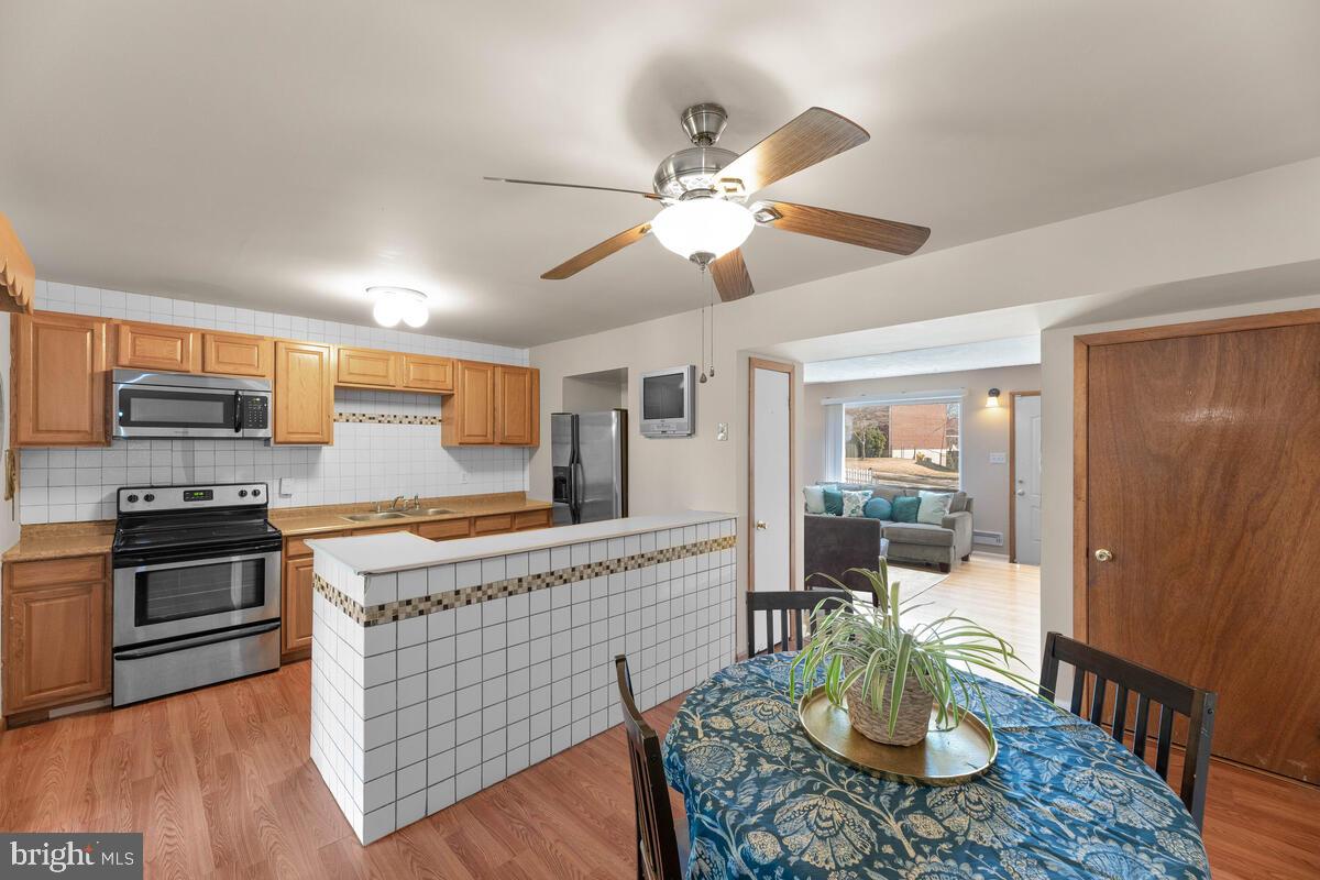 670 Queensgate Road Baltimore, MD 21229 - Photo 2 of 26 Dining room has been opened with an island