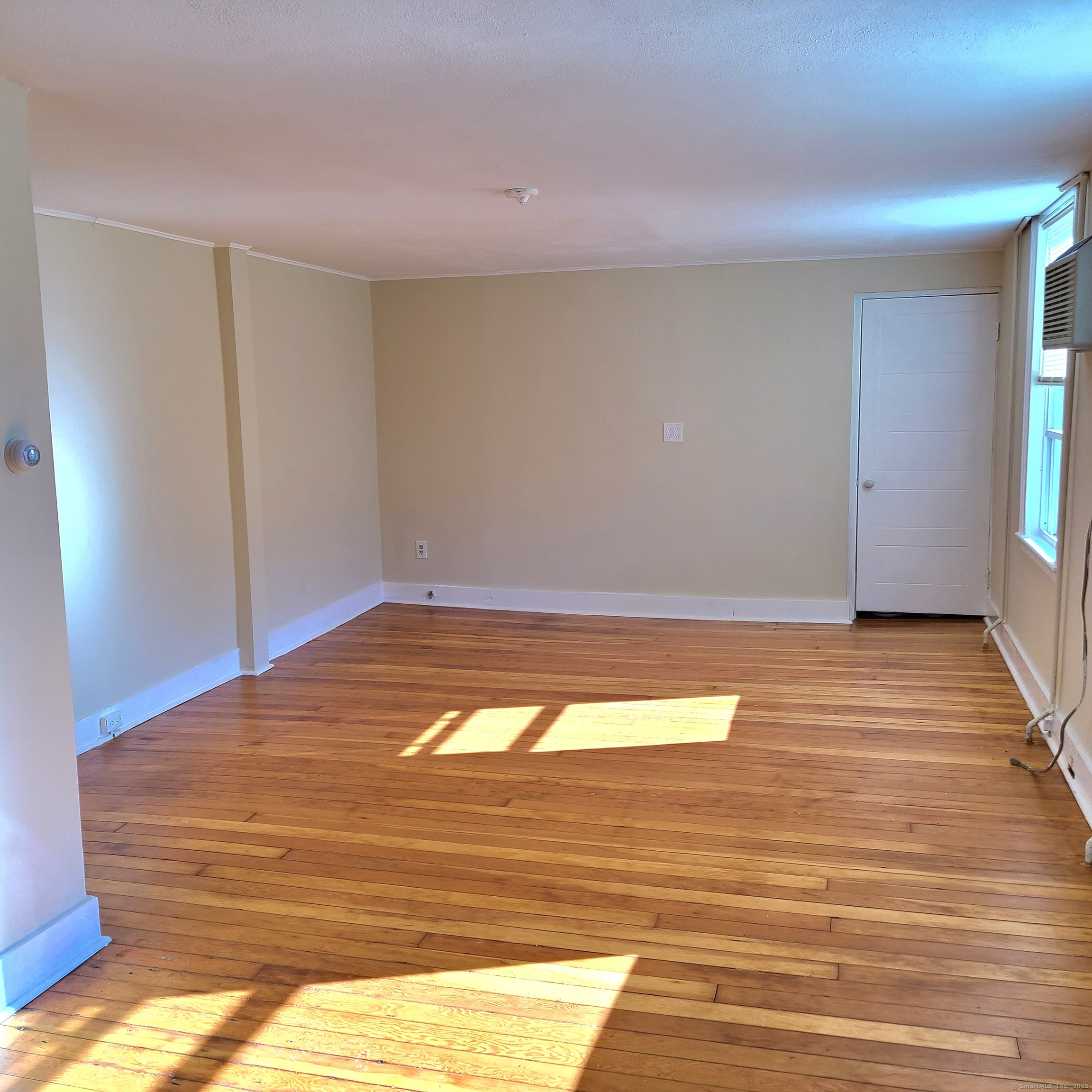 831 Boston Post Road Madison, CT 06443 - Photo 9 of 13 Living room off the kitchen