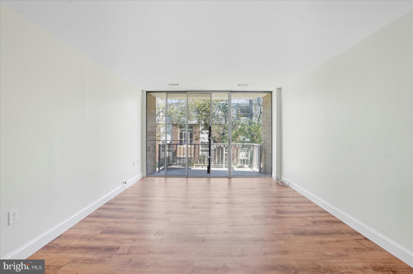 3960 Bel Pre Road, Unit 4 Silver Spring, MD 20906 - Photo 13 of 35 Bright, airy space with balcony views.