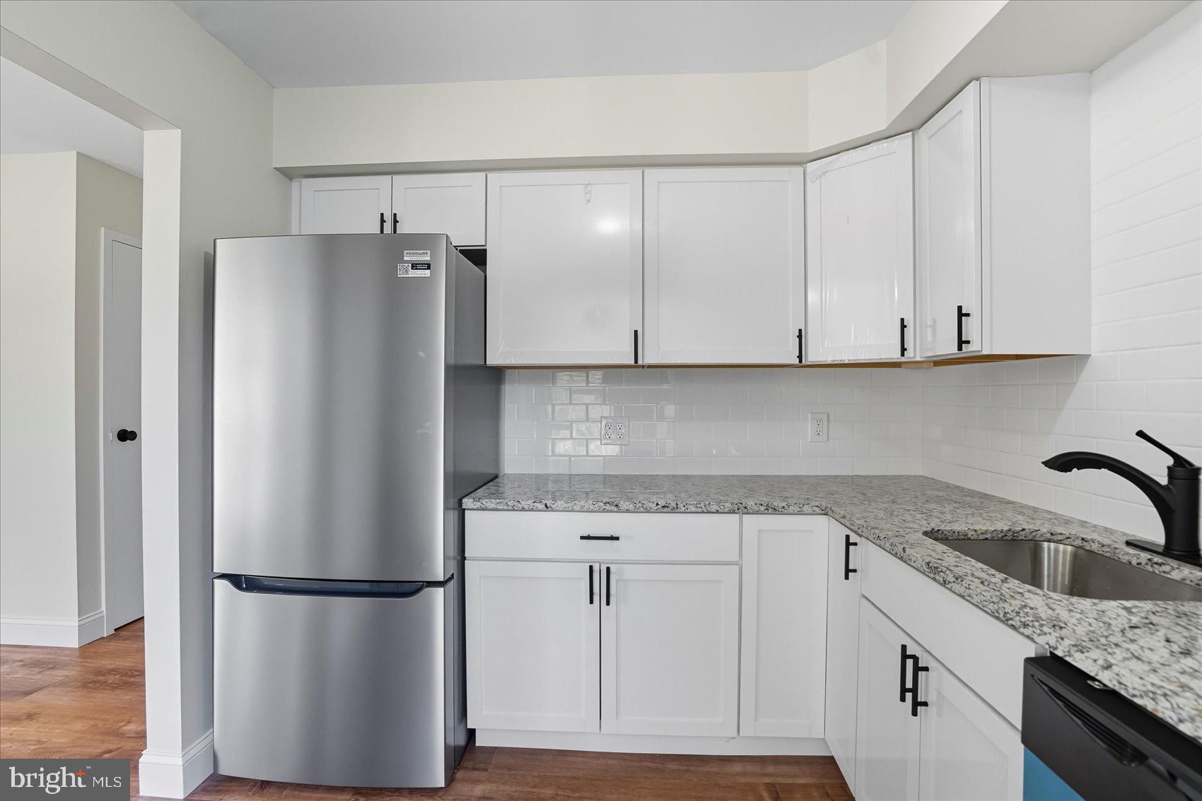 3960 Bel Pre Road, Unit 4 Silver Spring, MD 20906 - Photo 23 of 35 Modern kitchen with sleek appliances.
