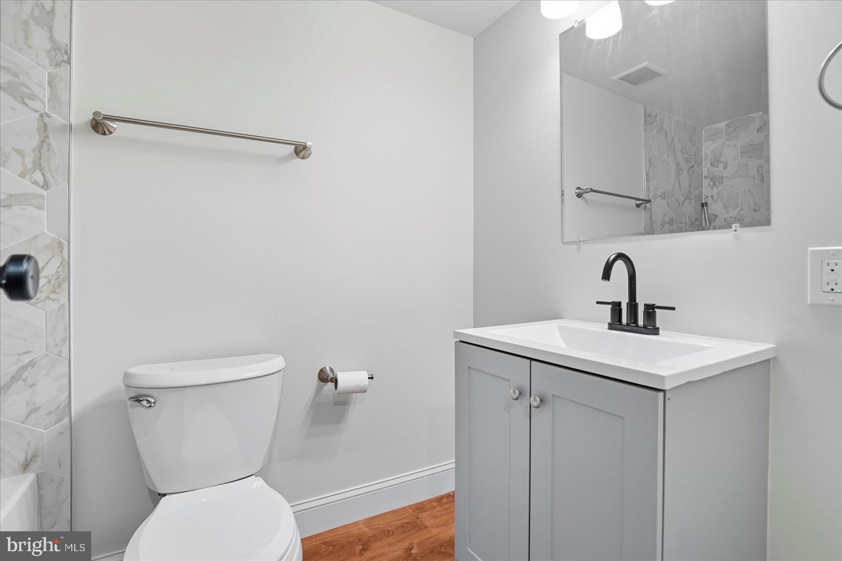 3960 Bel Pre Road, Unit 4 Silver Spring, MD 20906 - Photo 25 of 35 Modern bathroom with sleek finishes.