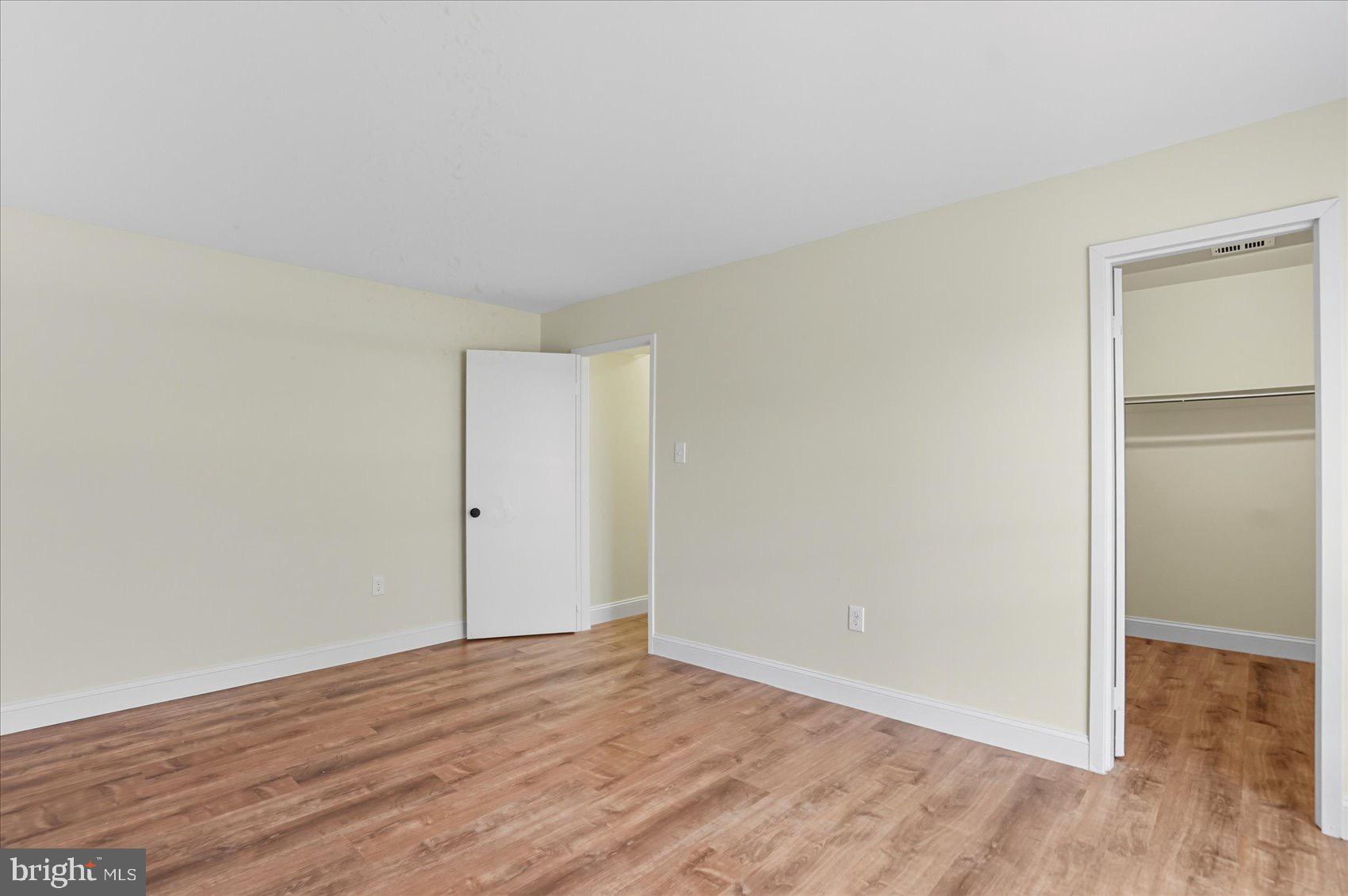 3960 Bel Pre Road, Unit 4 Silver Spring, MD 20906 - Photo 29 of 35 Spacious room with warm wood flooring.