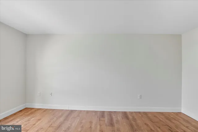a bathroom with a granite countertop toilet and a shower