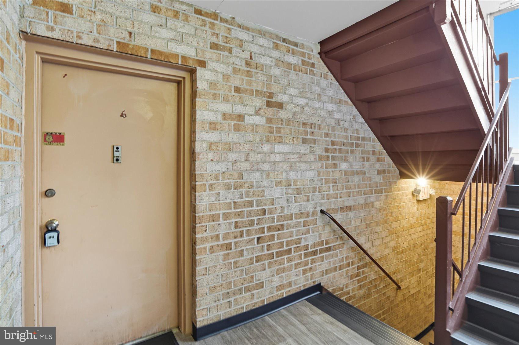 3960 Bel Pre Road, Unit 4 Silver Spring, MD 20906 - Photo 9 of 35 Inviting entrance with warm brick accents.