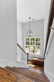 a view of an entryway with wooden floor