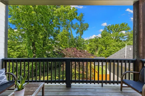 a view of a balcony with wooden floor