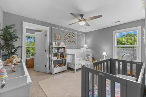 a children room with toys and a window