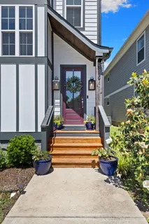 a view of entryway with hardwood and furniture