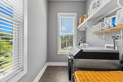 a bedroom with bed and a window