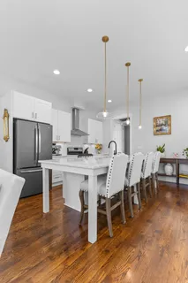 a kitchen that has a lot of cabinets and refrigerator