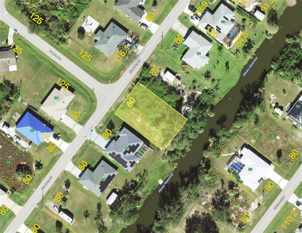an aerial view of a residential houses with outdoor space
