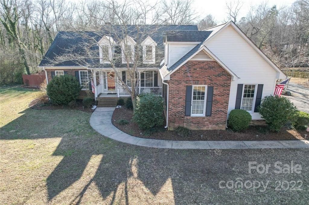 2700 Dutch Road Mount Pleasant, NC 28124 - Photo 1 of 48 a front view of a house with garden