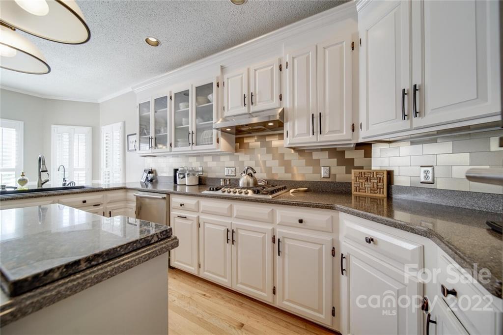 2700 Dutch Road Mount Pleasant, NC 28124 - Photo 12 of 48 a kitchen with granite countertop white cabinets and a sink