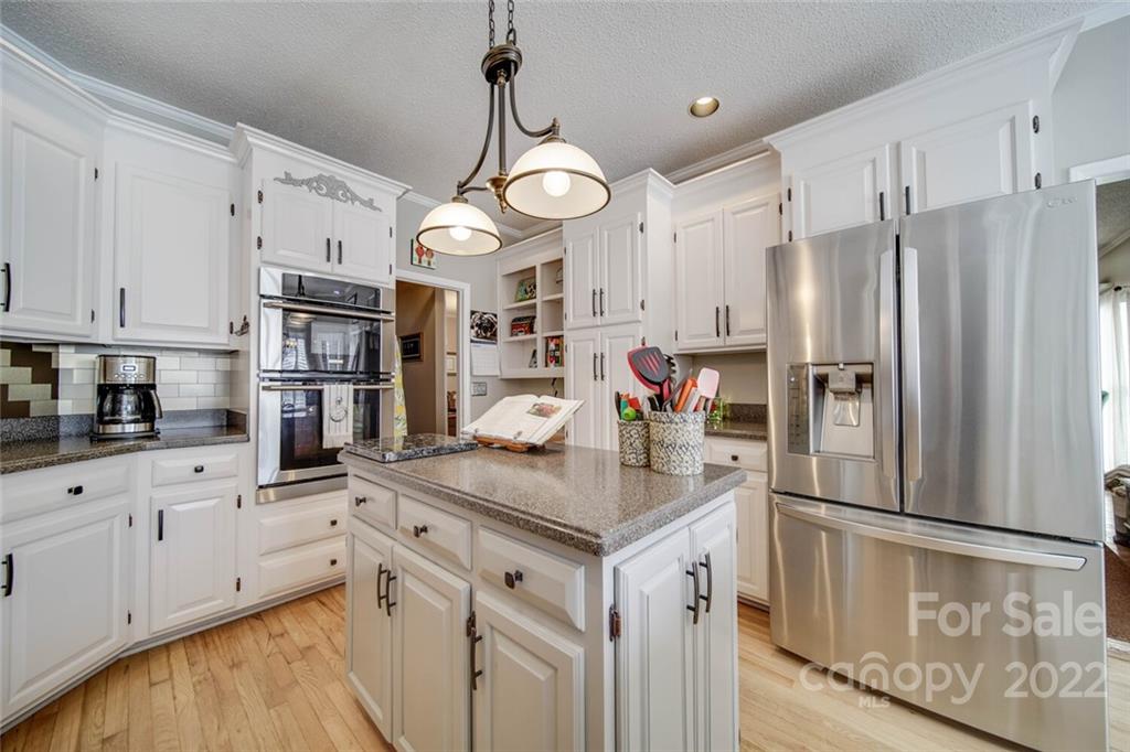 2700 Dutch Road Mount Pleasant, NC 28124 - Photo 13 of 48 a kitchen with cabinets and stainless steel appliances
